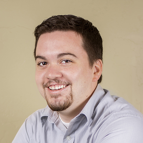 A professional headshot of Todd Goates: a dark-haired, caucasian male in his early thirties